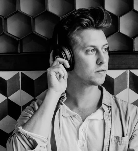 A man with headphones he bought in Audiophile store